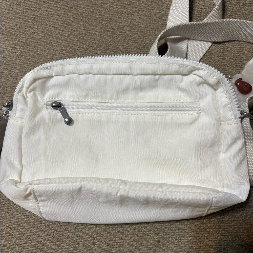 Kipling Small Crossbody Bag in White with Plush Monkey Charm